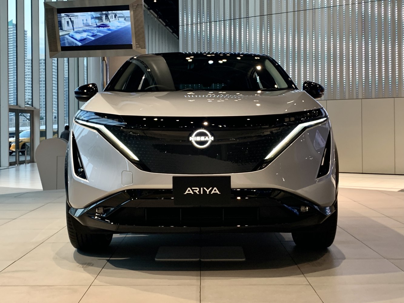 Front view with LED headlights and black aerodynamic grille