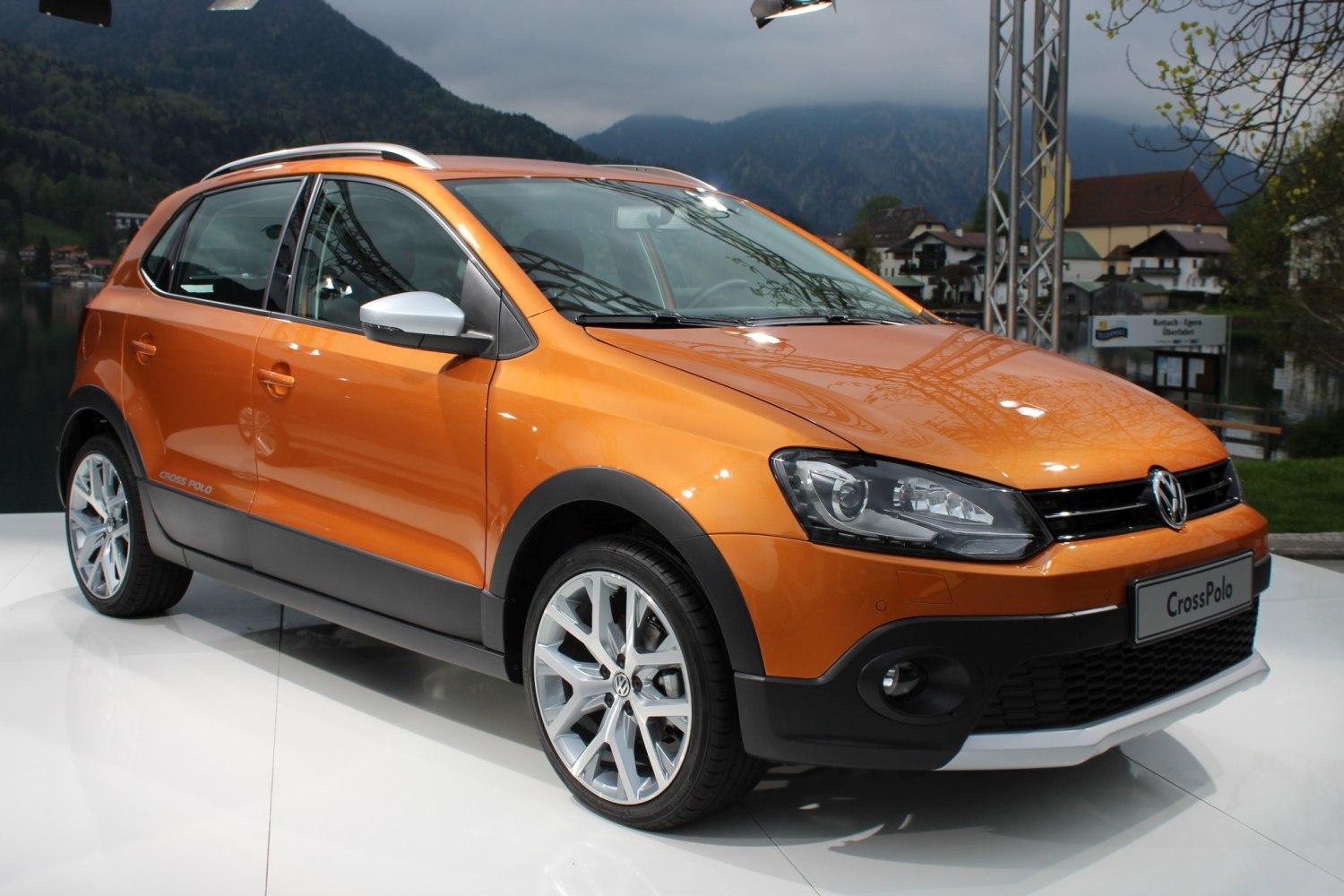 Front side view of orange compact crossover with sporty design