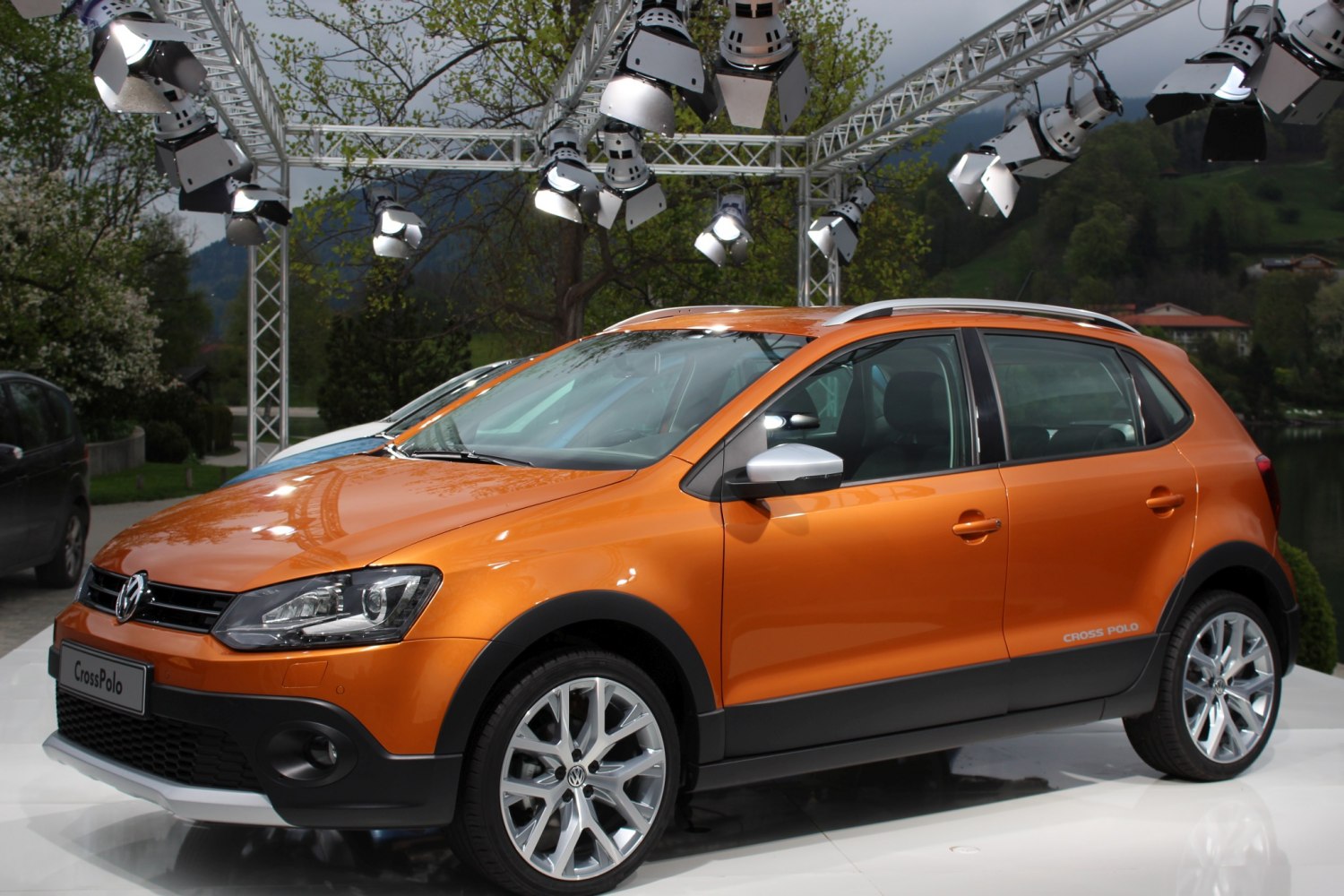 Orange compact hatchback with rugged black cladding and alloy wheels
