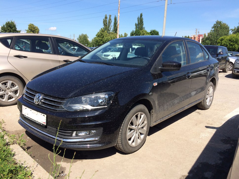 Front side view of a compact sedan with updated headlights and grille.
