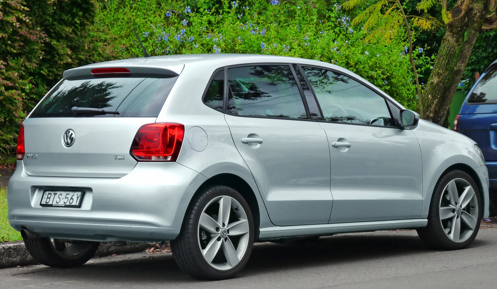 Rear and side view of 5-door hatchback with distinct tail lights and alloy wheels