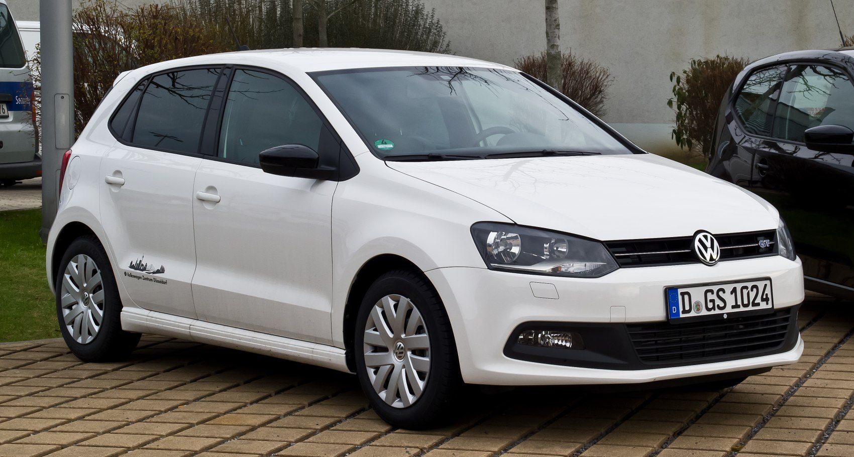 White 5-door hatchback, front and side exterior view