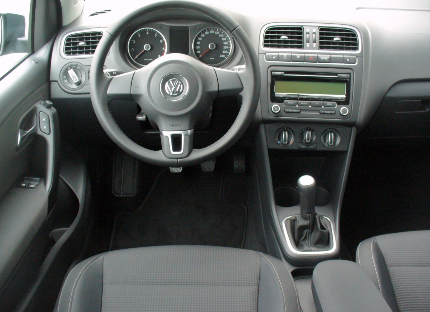 Dashboard and steering wheel with manual transmission gear stick