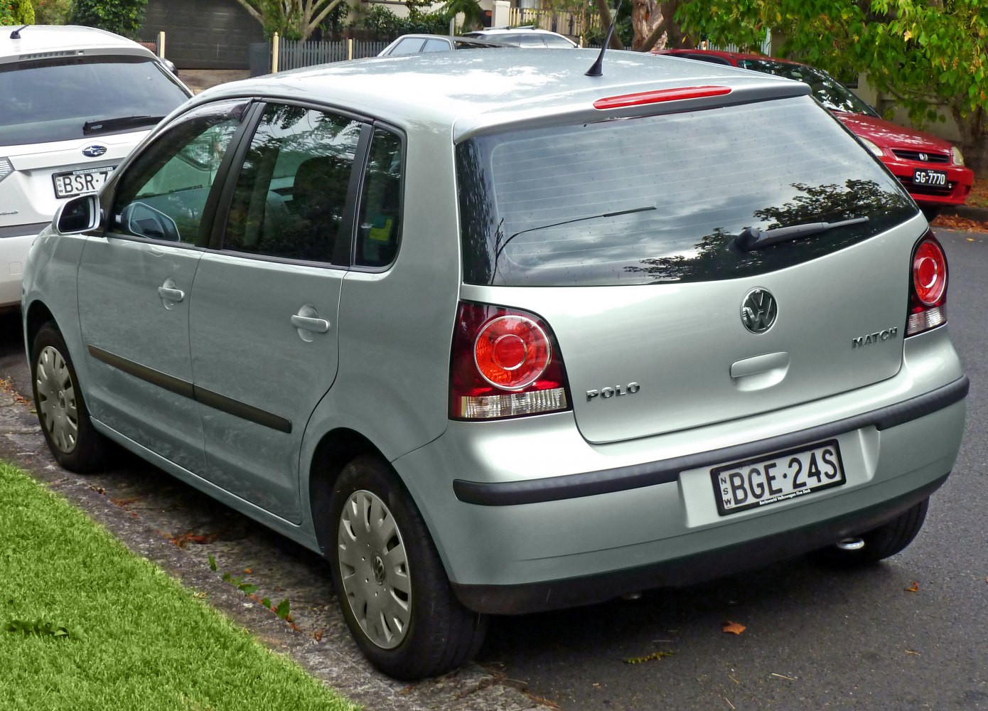 Rear hatchback view with distinctive rounded taillights and 5-door compact design
