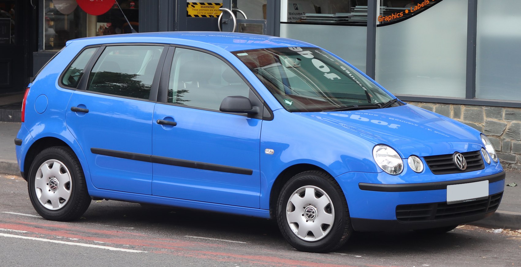 Blue compact hatchback with rounded headlights and five doors.