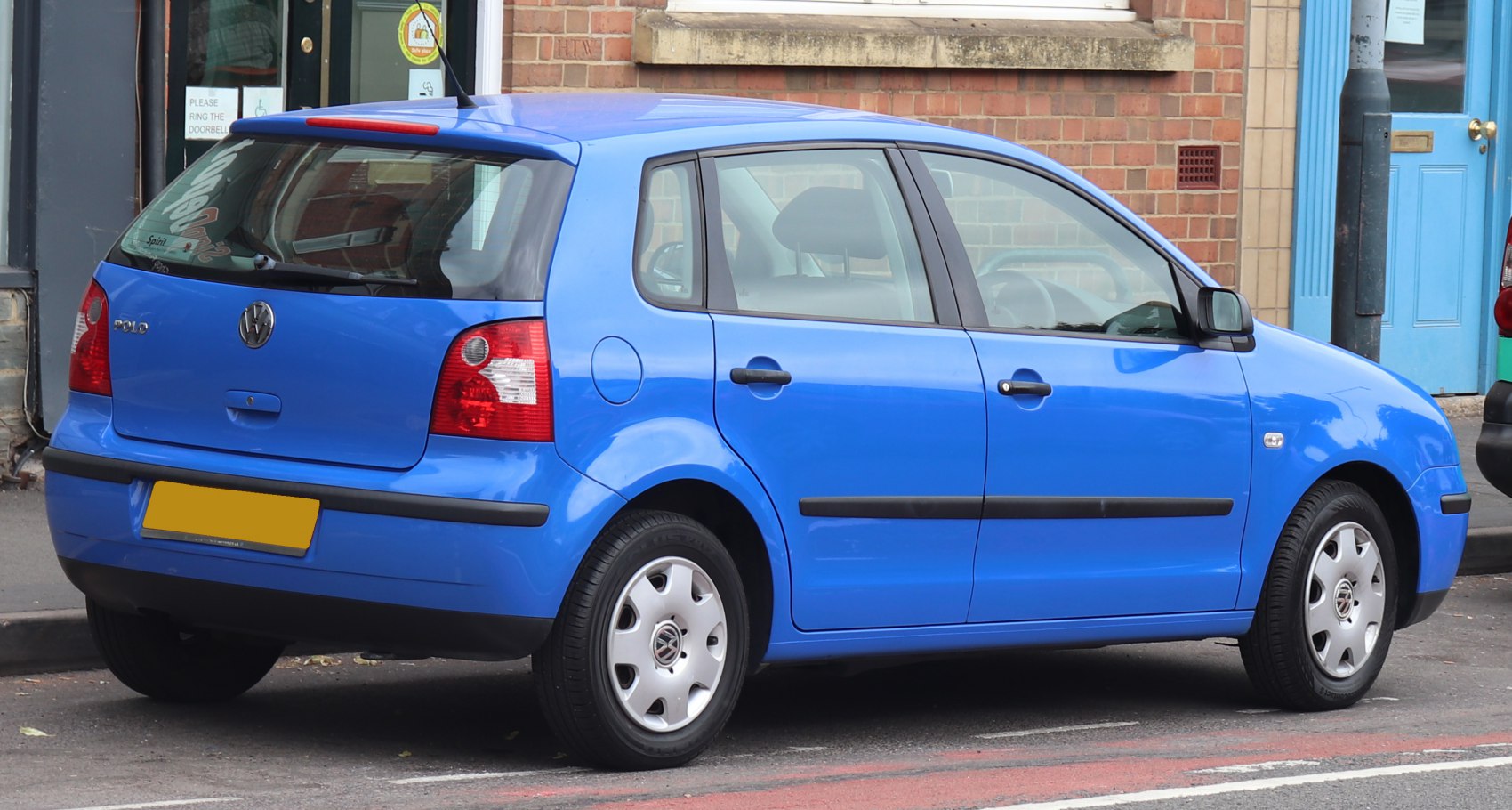 Blue compact hatchback rear side view with five doors and alloy wheels