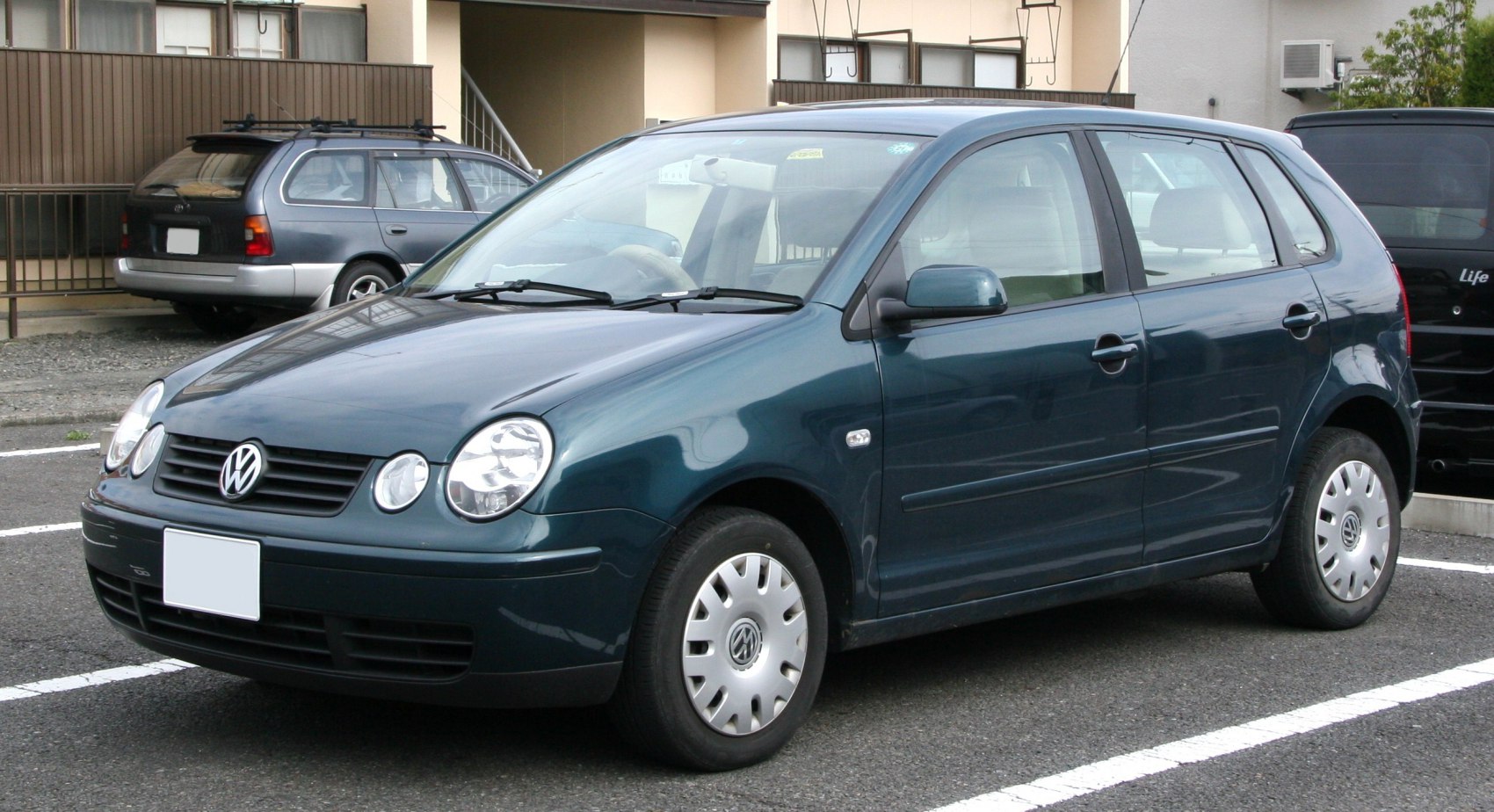 Compact hatchback with round dual headlights and side profile