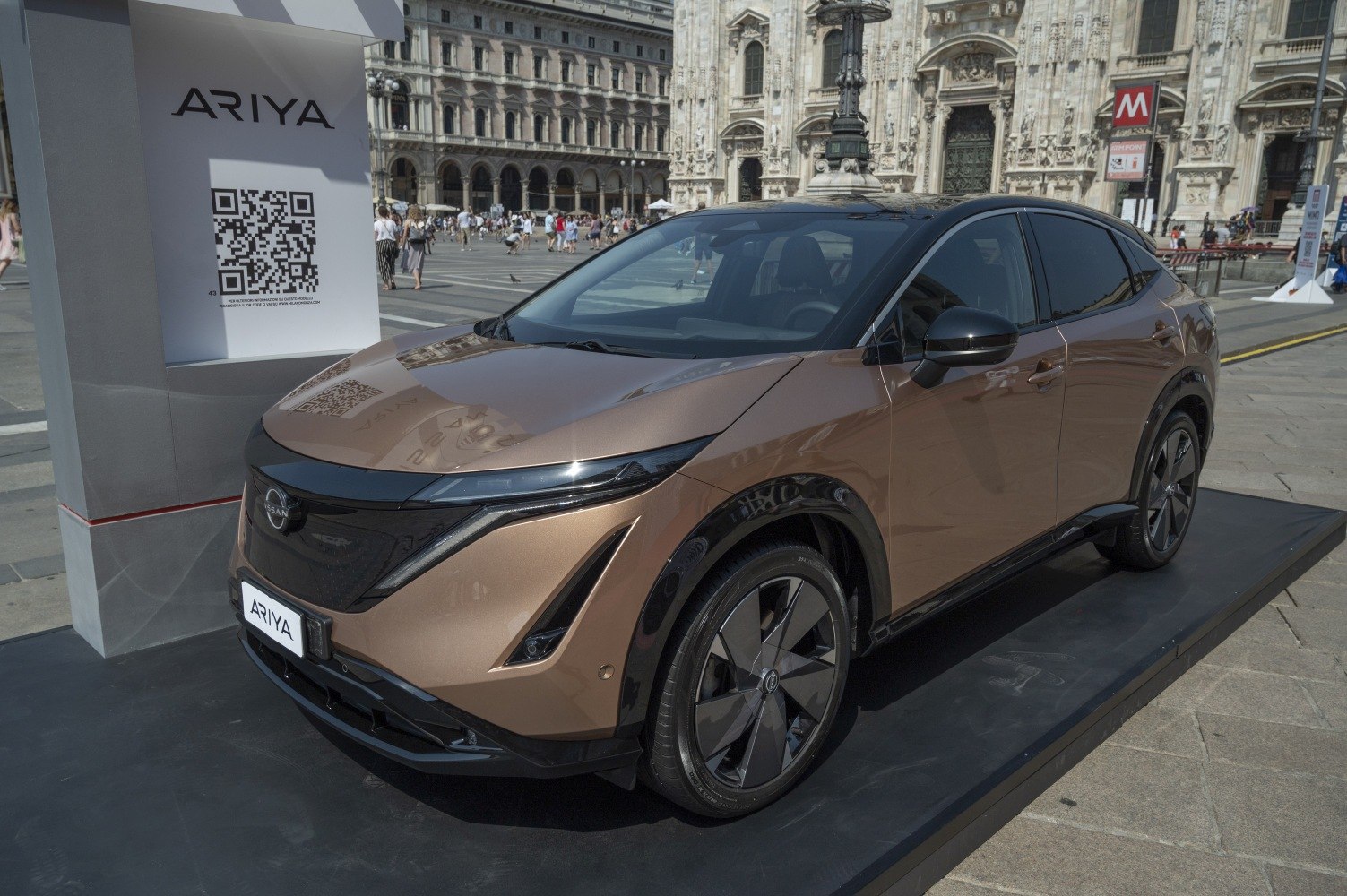 Front and side view of an electric SUV with LED headlights and aerodynamic design.