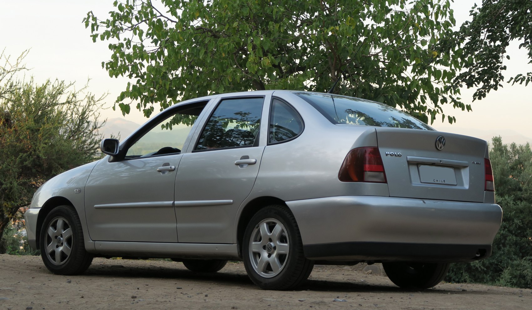 Silver sedan showing rear quarter and side profile