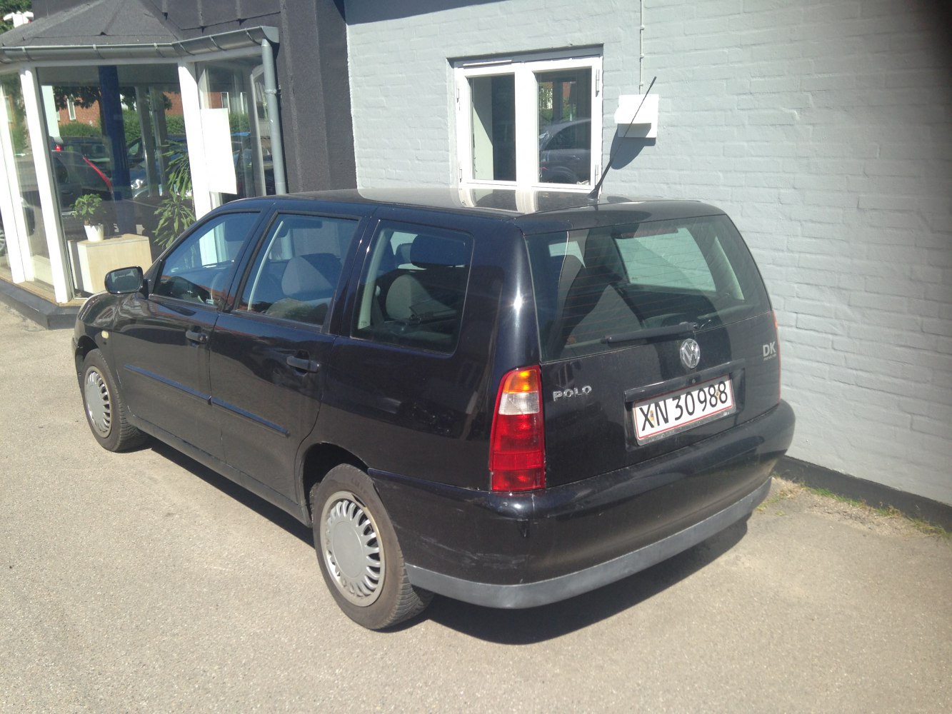 Rear side view of a compact station wagon with hatchback design