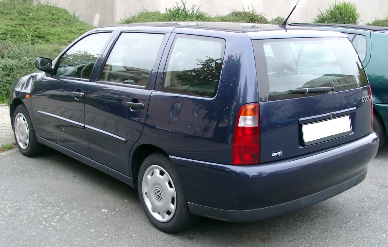 Rear-side view of a classic station wagon with distinct taillights and hatchback style