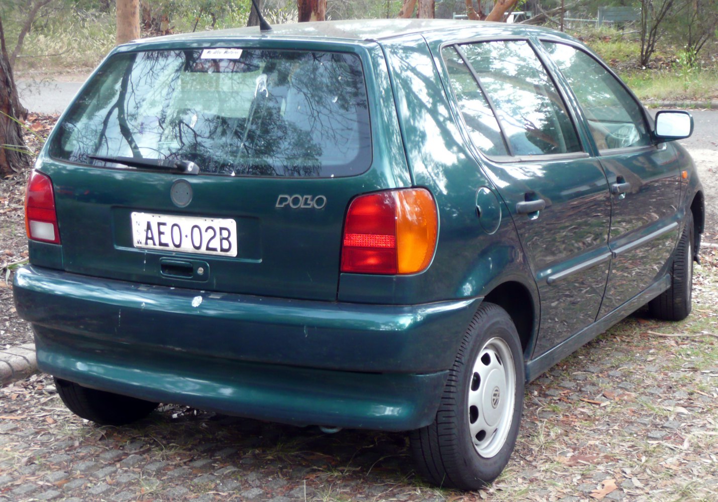 Rear view of a hatchback with distinct taillights and rear window