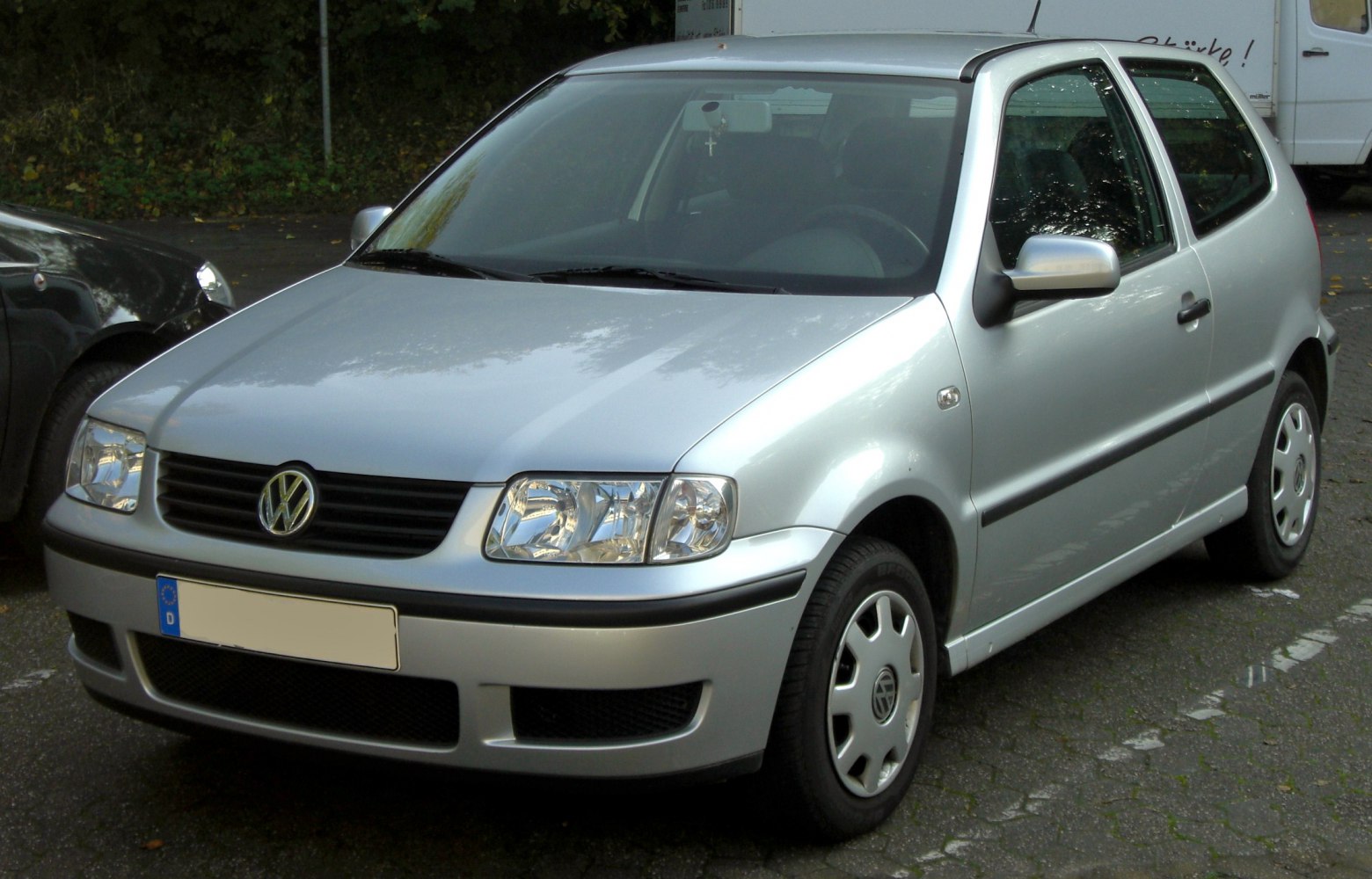 Front-side angle of compact hatchback highlighting grille and headlights