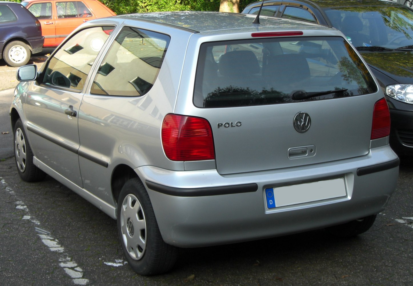 Compact hatchback rear view with distinctive taillights and rear window