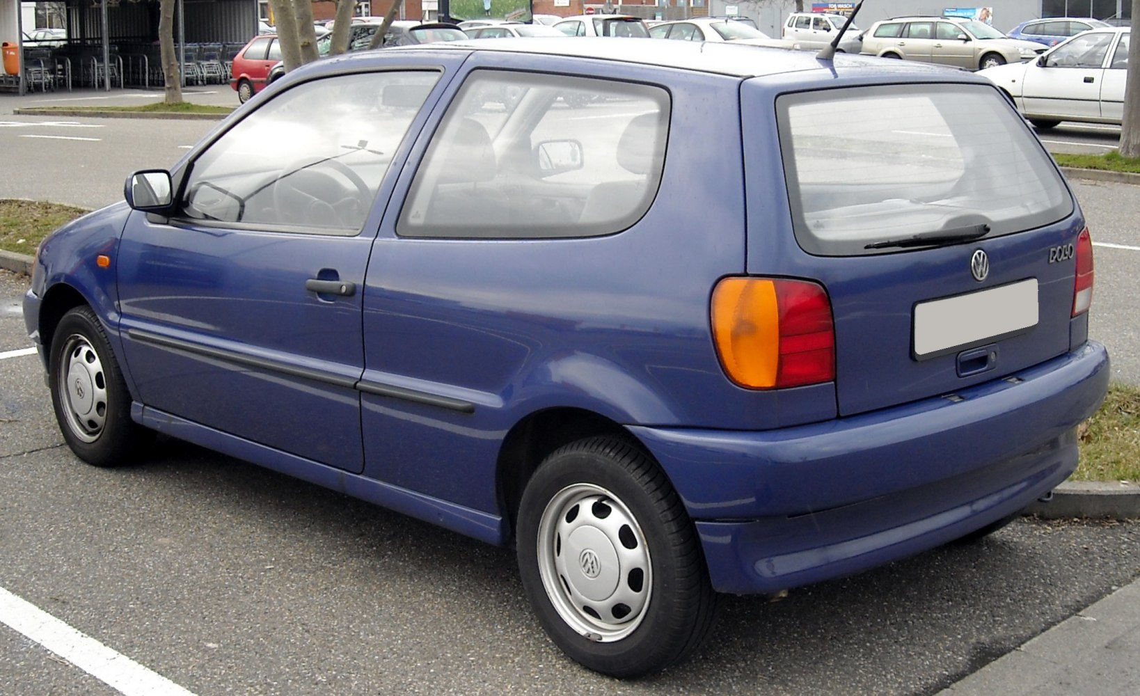 Blue three-door compact hatchback with rounded tail lights and rear wiper