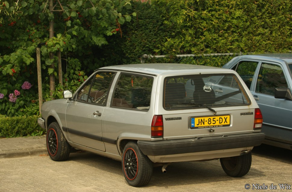 Rear view of a boxy 1980s small hatchback with rectangular tail lights and compact design