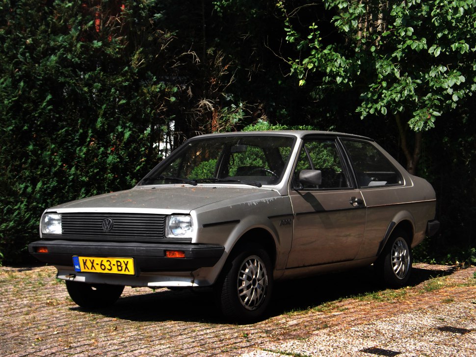 Classic two-door hatchback with rectangular headlights and alloy wheels