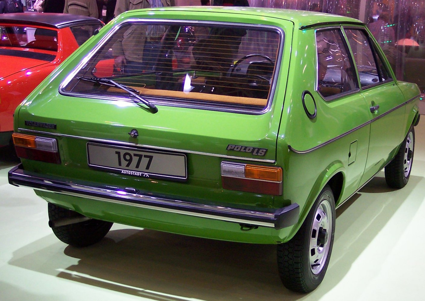 Rear hatchback view with vintage taillights, rear wiper, and chromed bumper