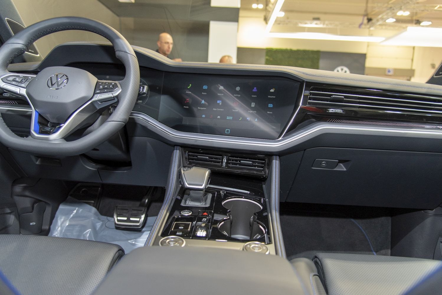Digital dashboard and central console with gear shifter and cup holders