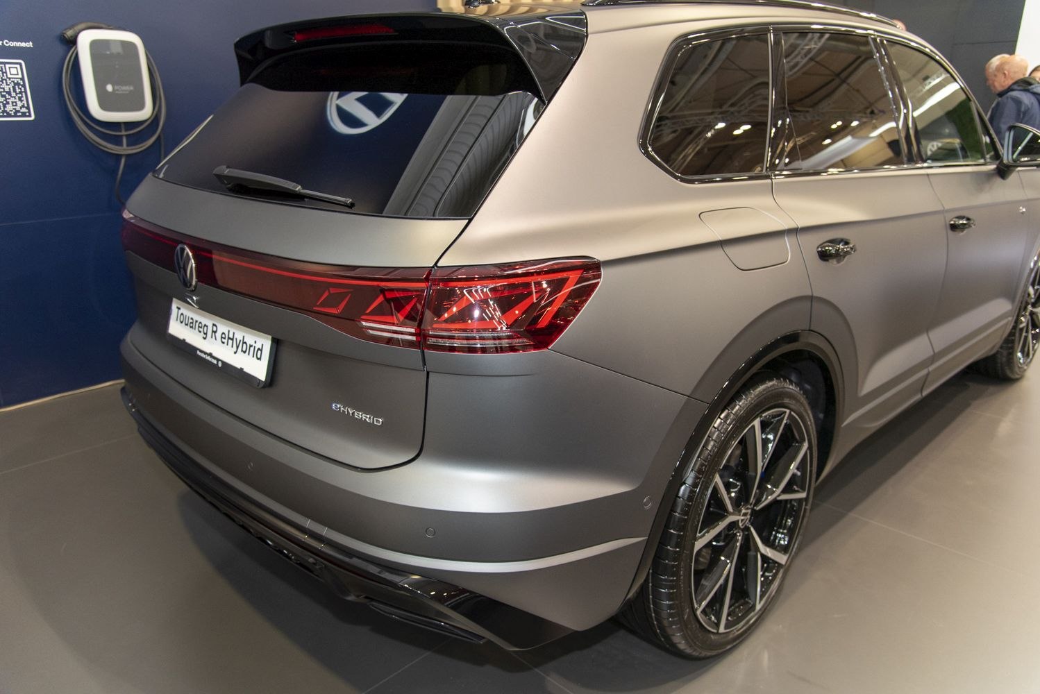 Rear view with taillights and alloy wheels of hybrid SUV