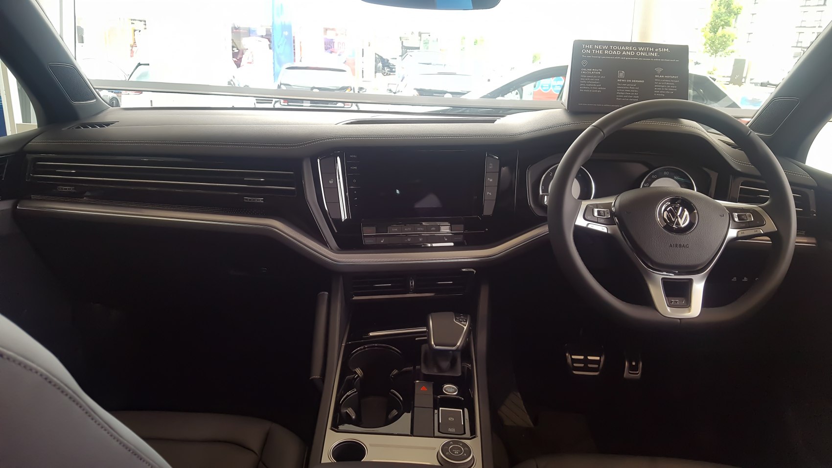 Modern SUV interior with digital dashboard and multifunction steering wheel