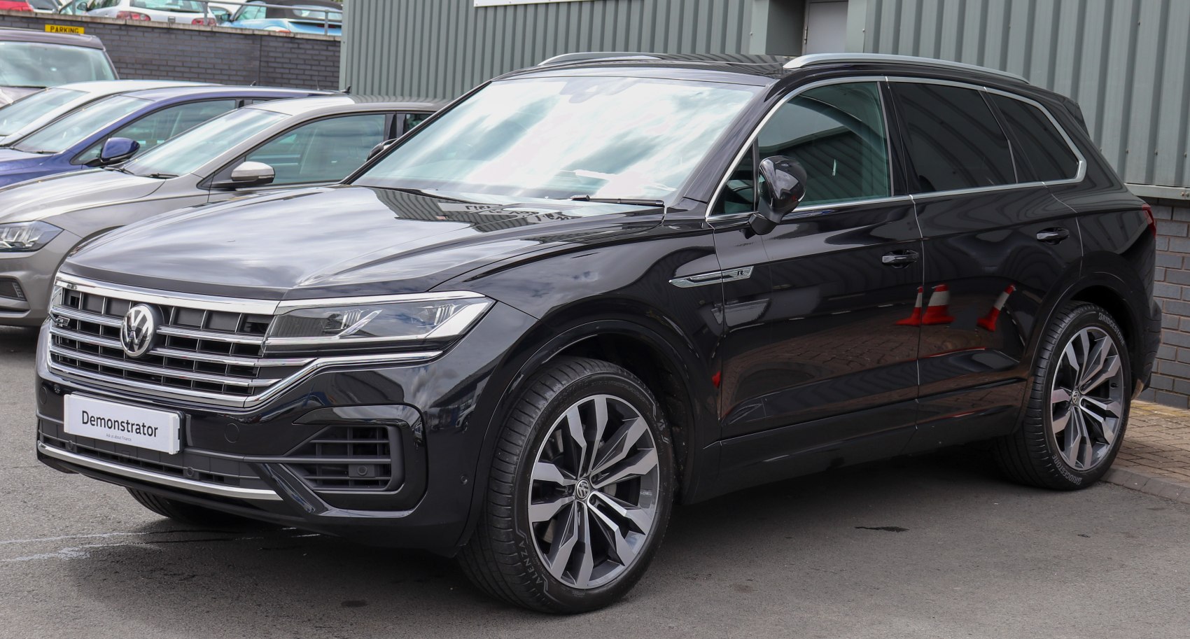 Black luxury SUV with LED headlights and alloy wheels