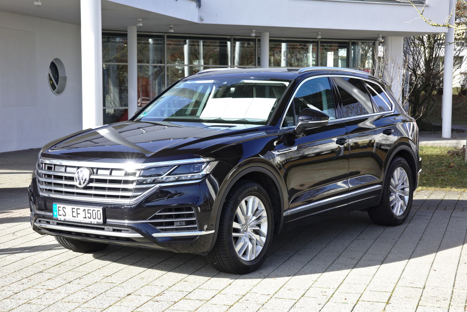 Front angle view with LED headlights and prominent chrome grille.