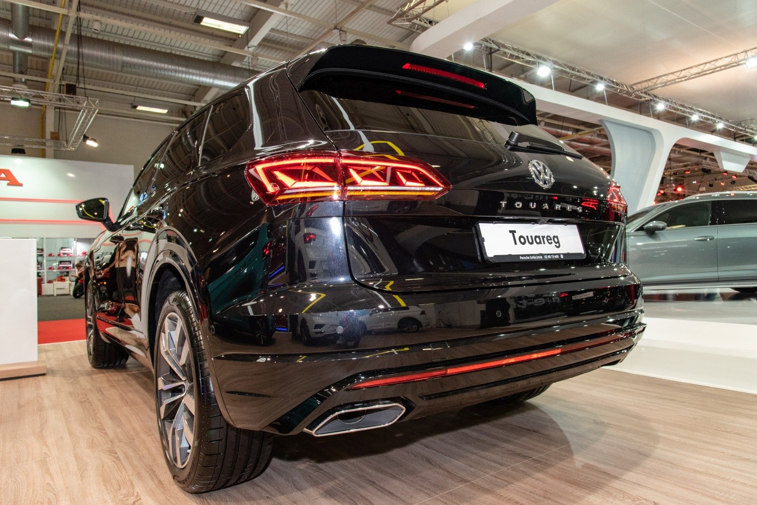 Sleek rear view with illuminated LED tail lights and dual exhausts