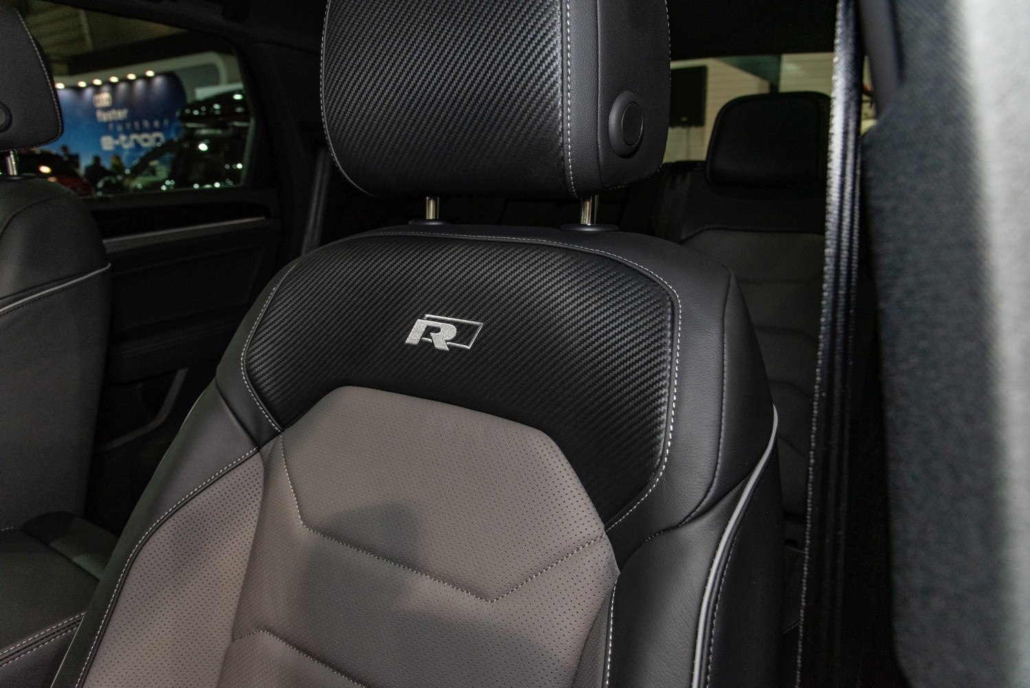Sport seat upholstery with carbon fiber and leather design