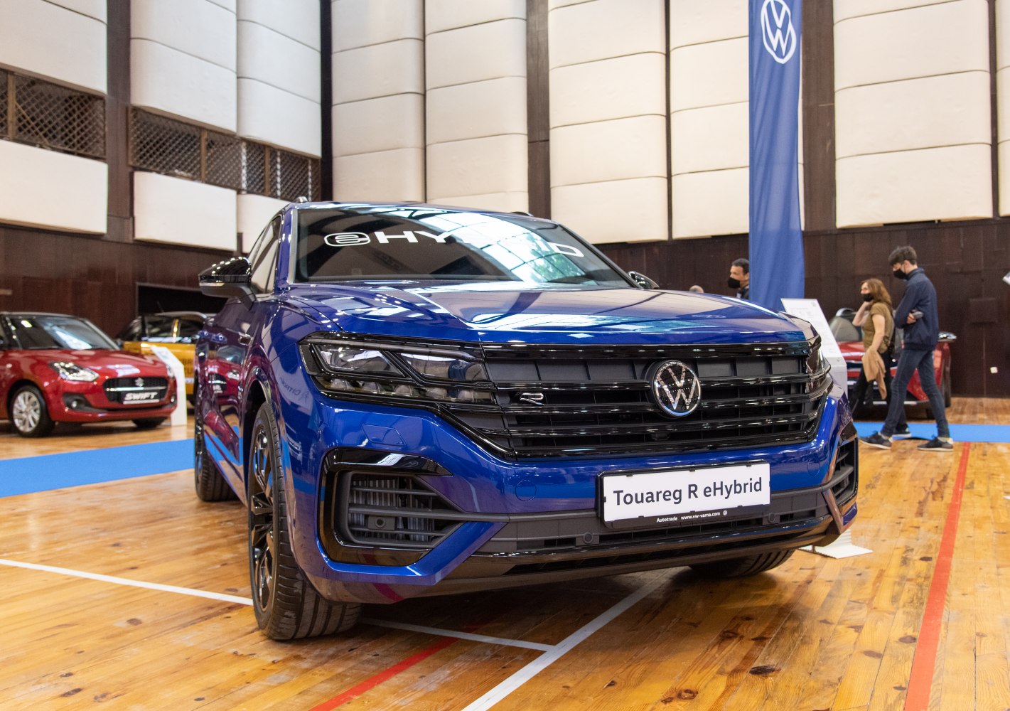 Front view of blue SUV with sleek grille and LED headlights