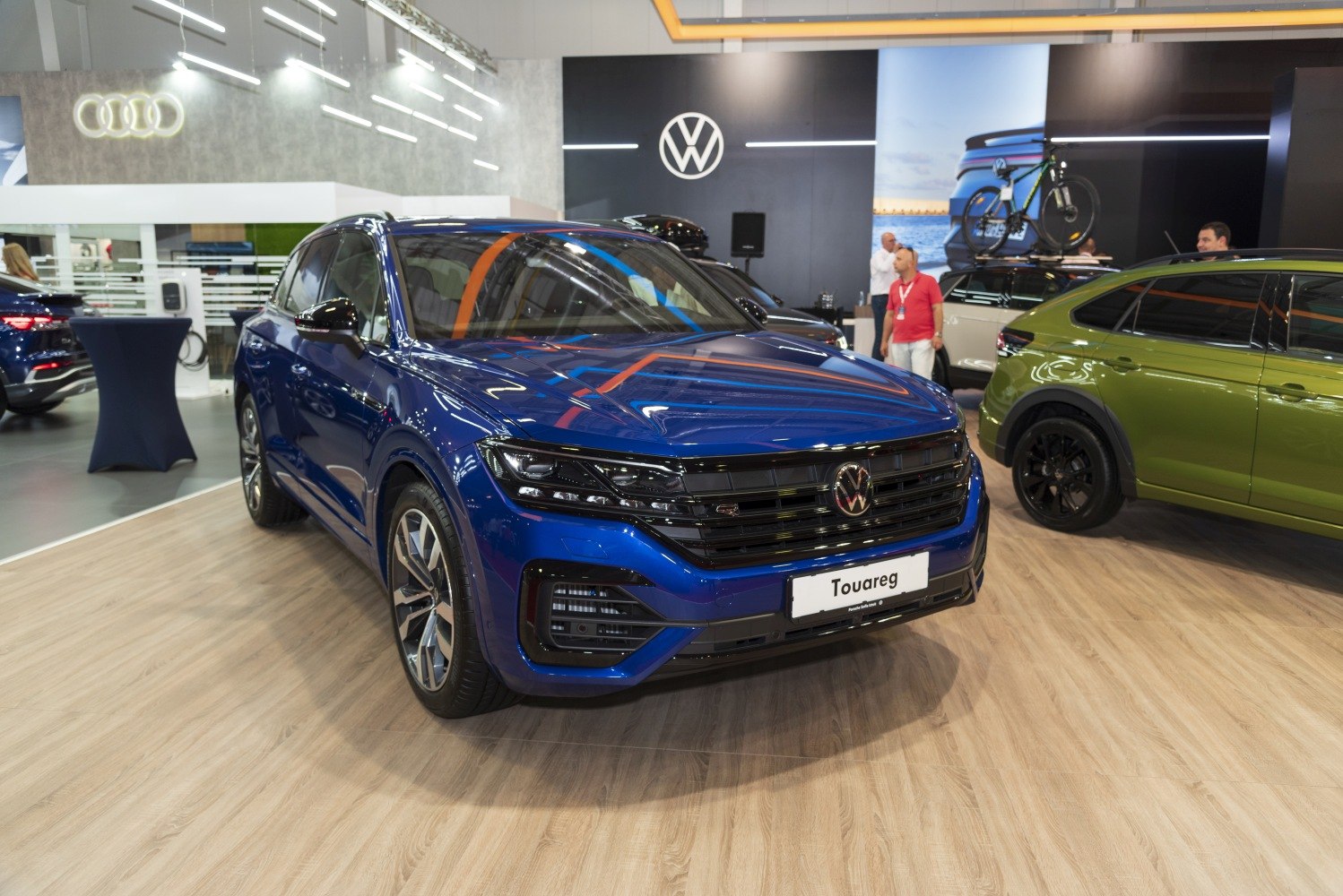Front view of blue SUV with LED headlights and bold grille