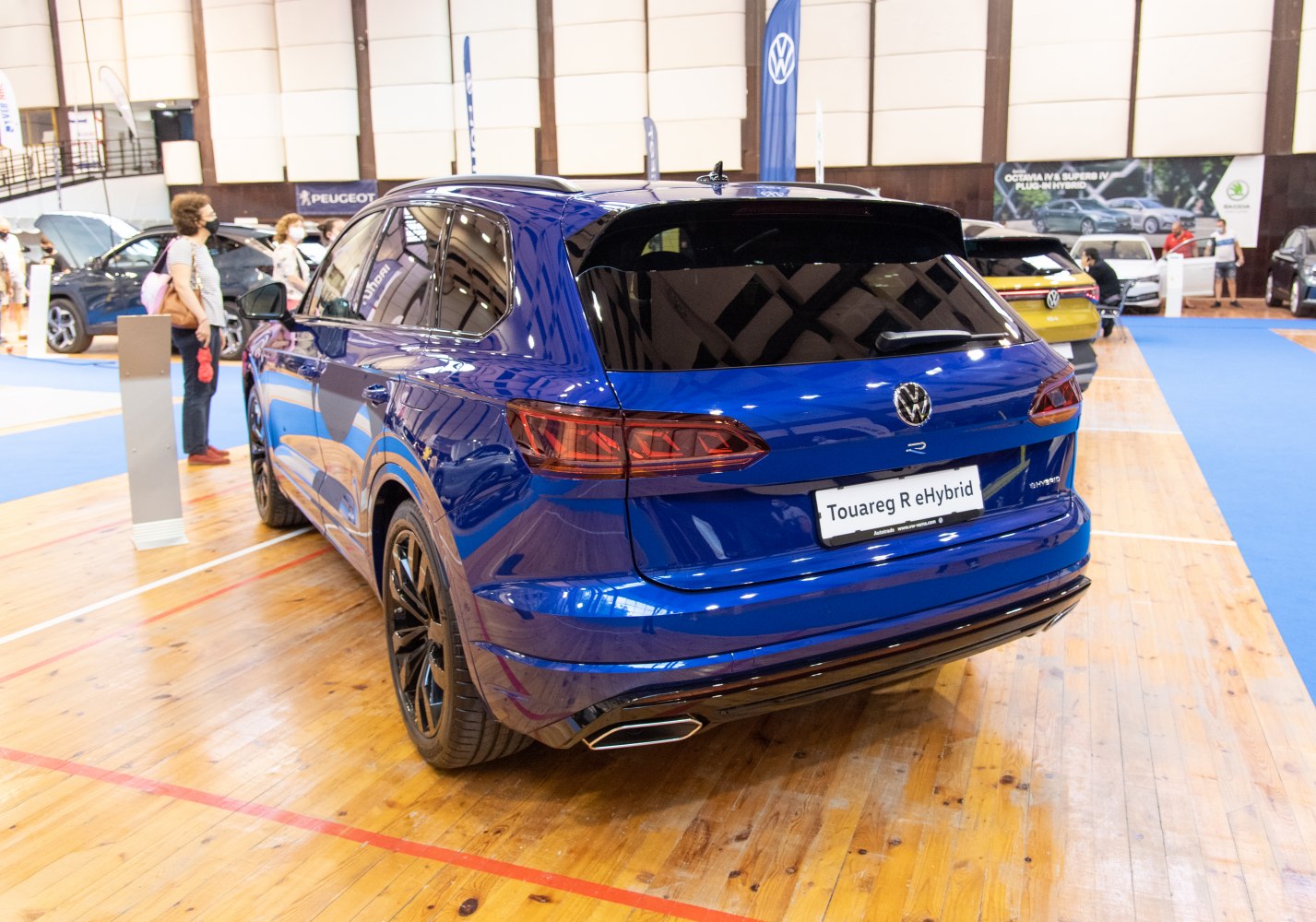 Rear view of blue SUV with hybrid badge and LED tail lights