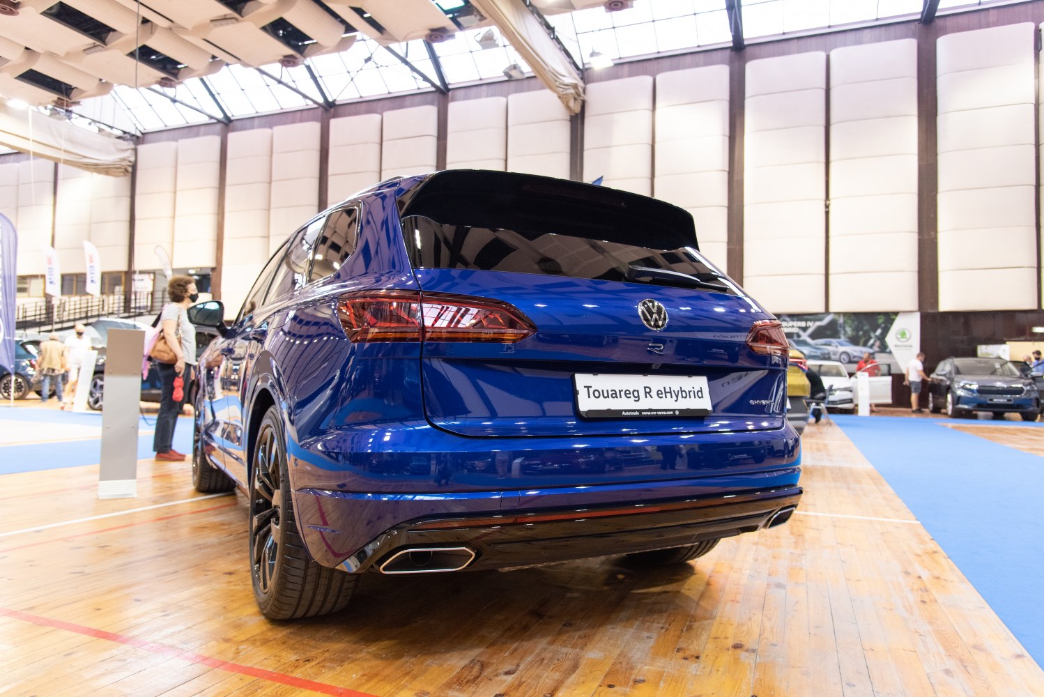 Rear view of blue SUV with dual exhausts and R-Line badge