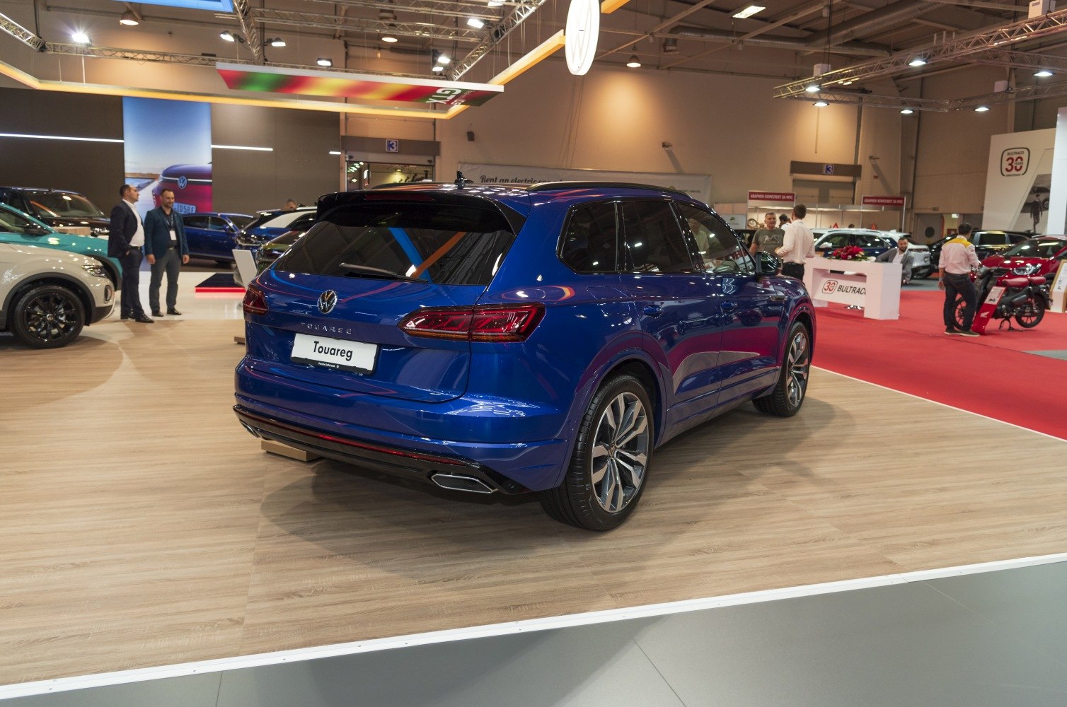 Rear view of a modern SUV with sleek taillights and dual exhausts