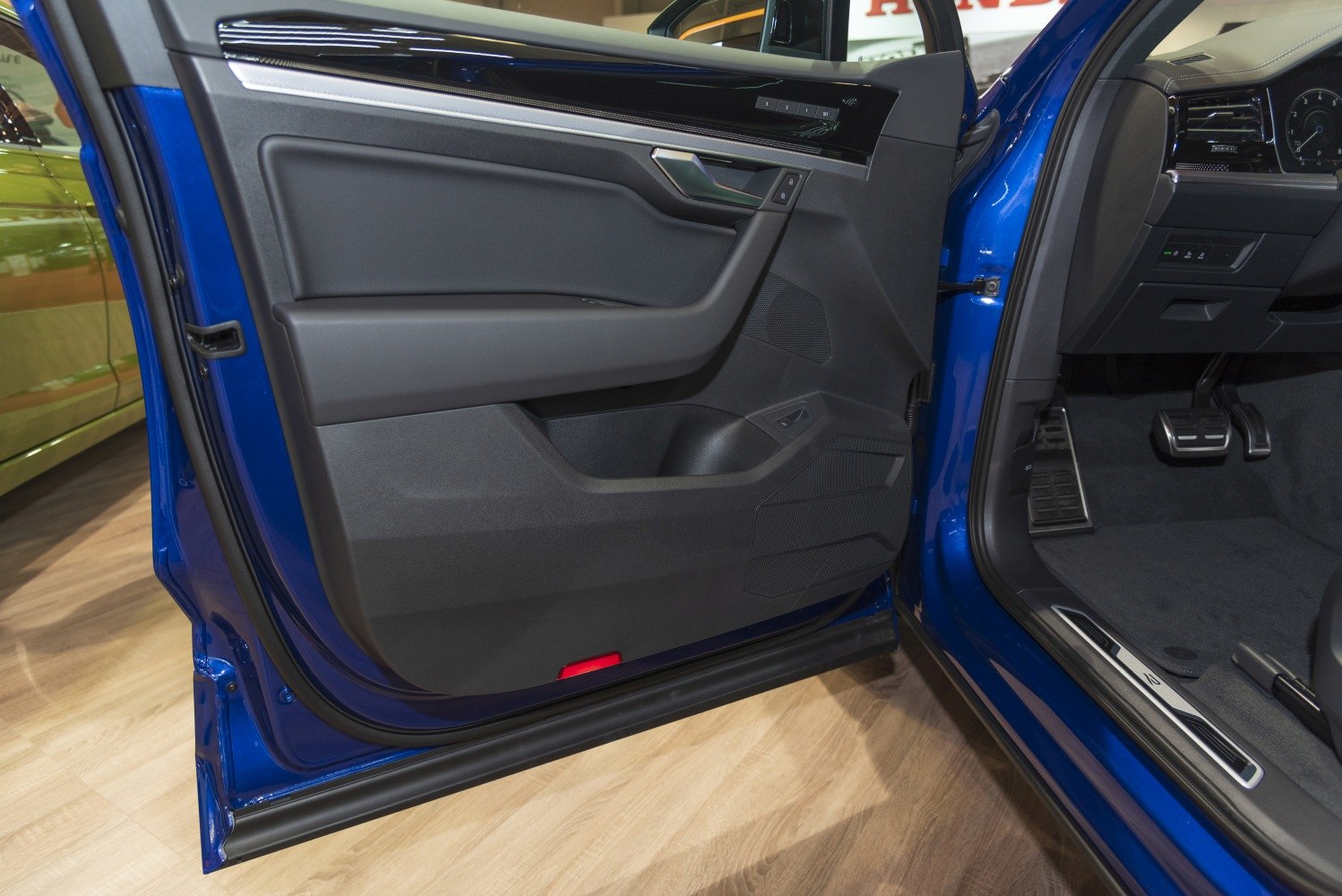 Interior door panel and driver foot pedals with control buttons