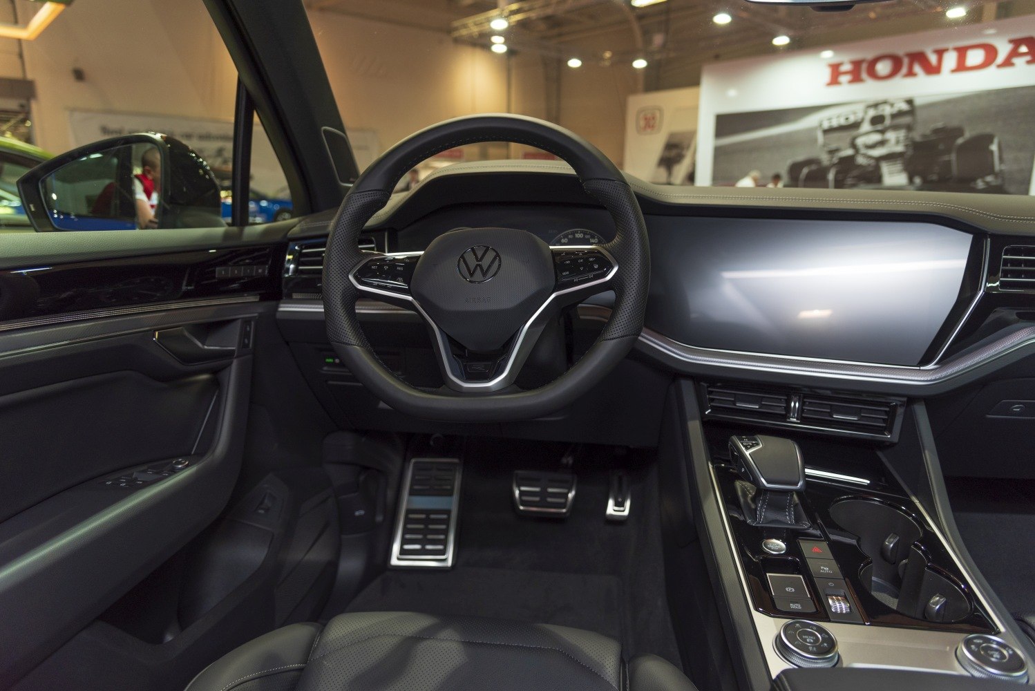 Modern steering wheel and digital infotainment display in vehicle interior