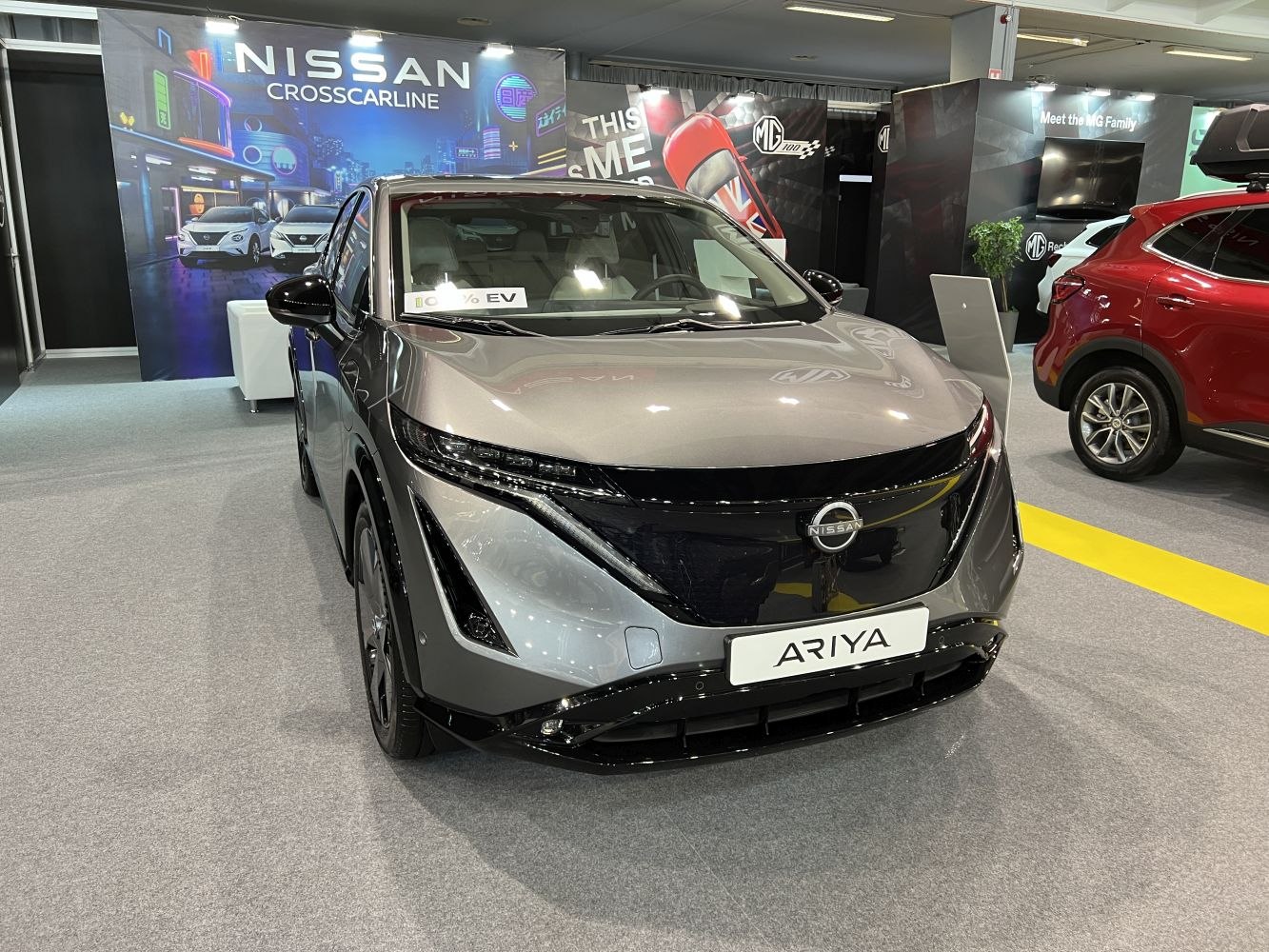 Front view of electric SUV with LED headlights and aerodynamic design.