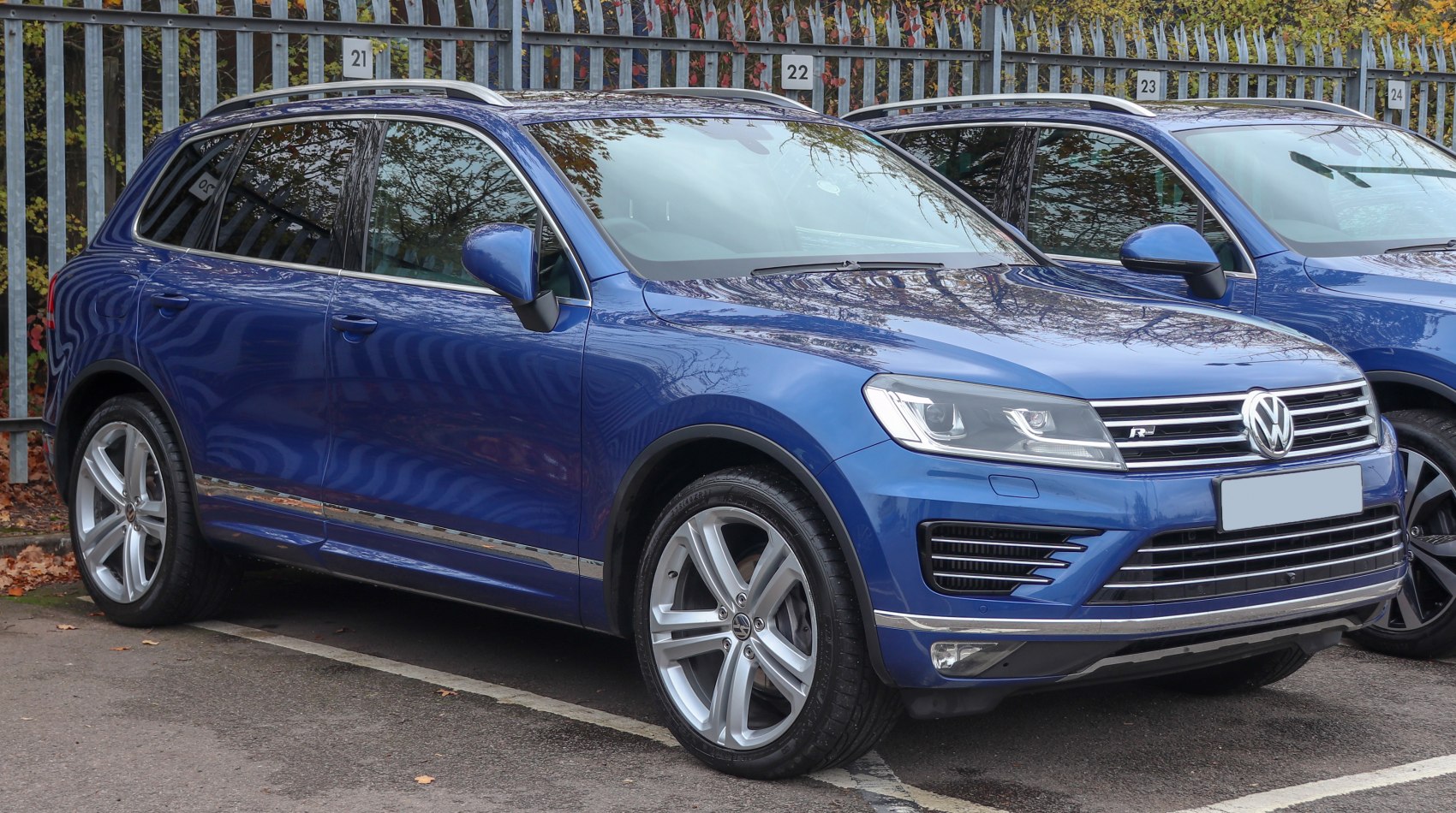 Blue SUV front and side view with chrome trim and alloy wheels