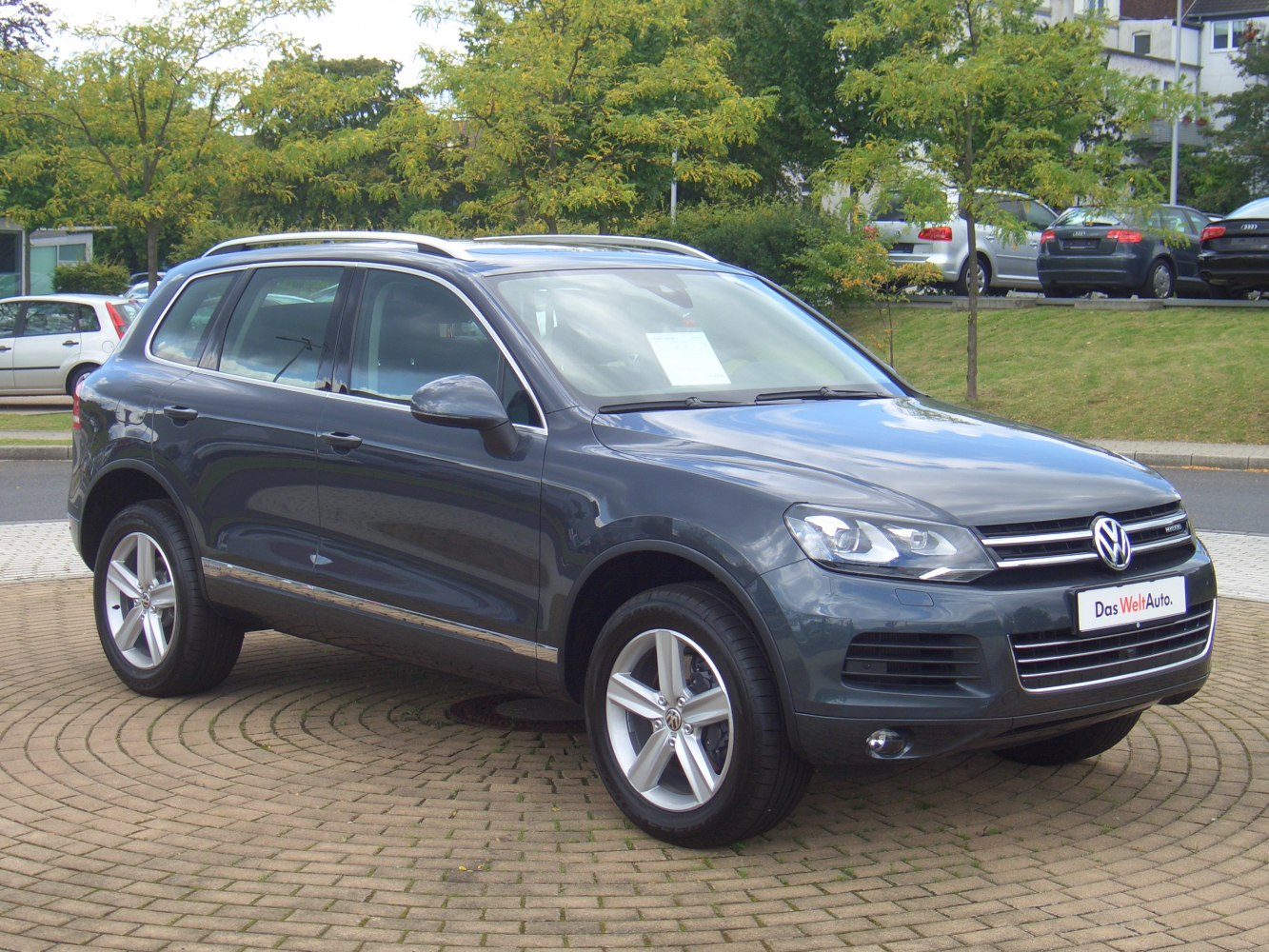 Front-side view of SUV with alloy wheels and roof rails