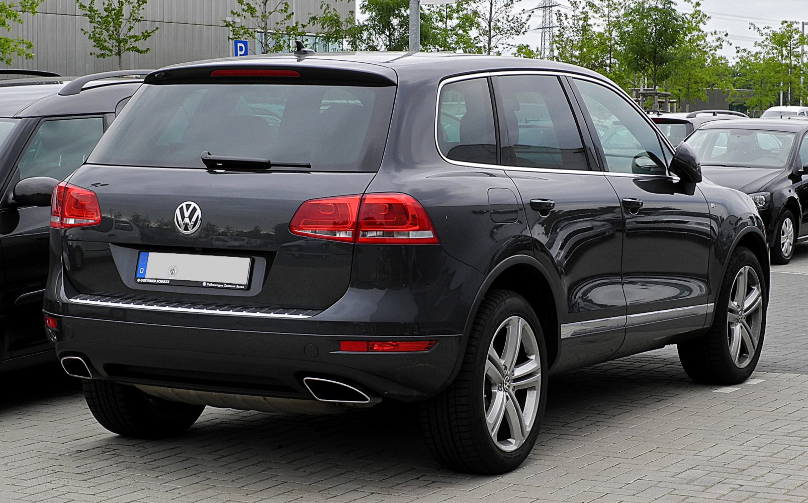 Rear view of SUV with distinct taillights and dual exhausts
