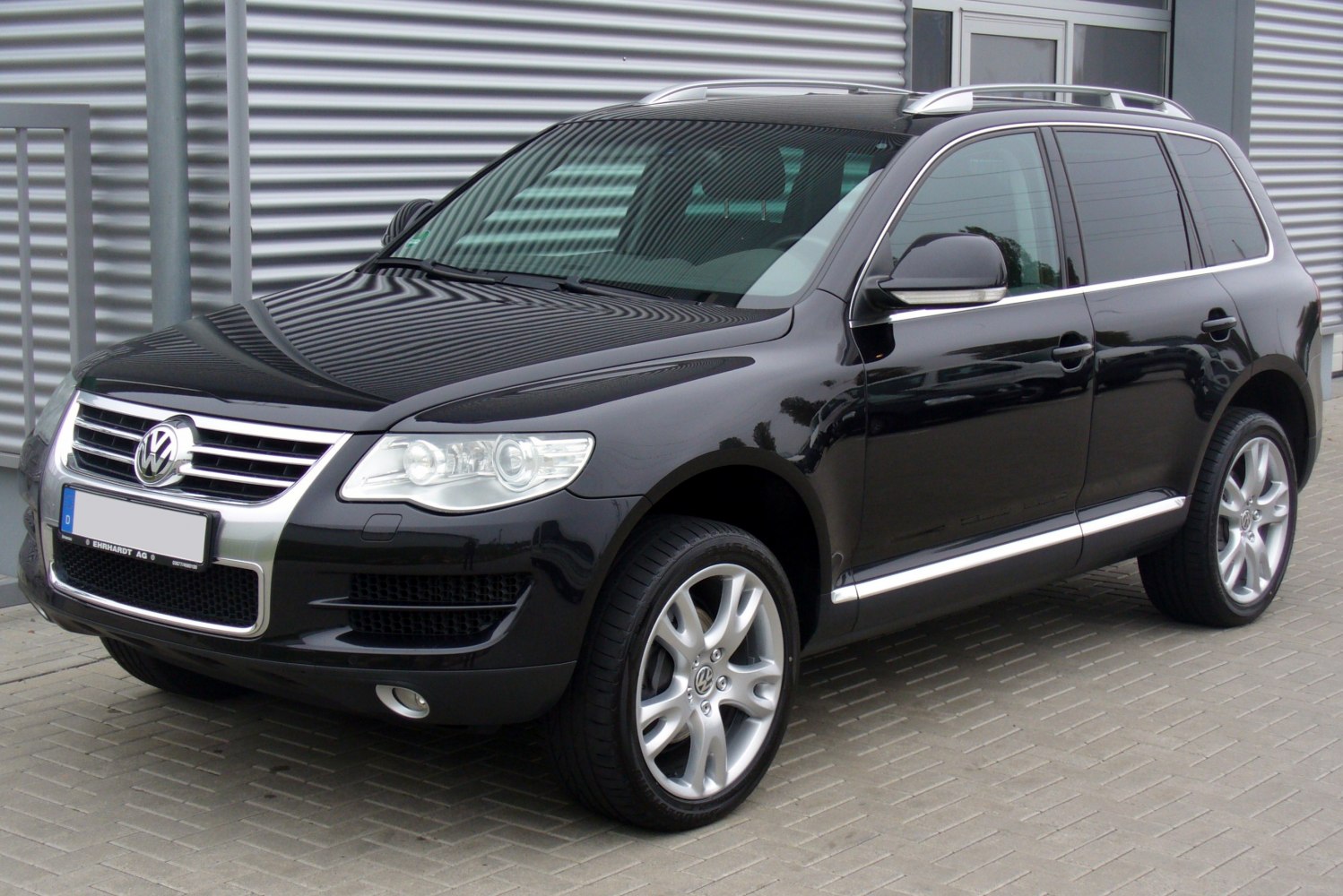 Black SUV front-side view with modern headlights and alloy wheels
