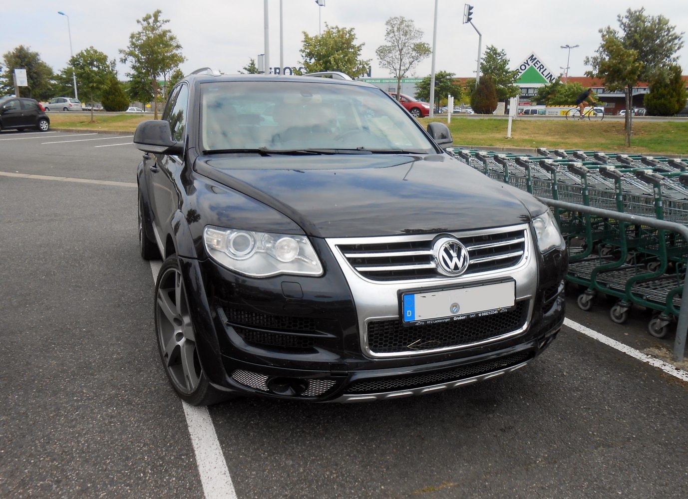 Front view of black SUV with prominent grille and headlights
