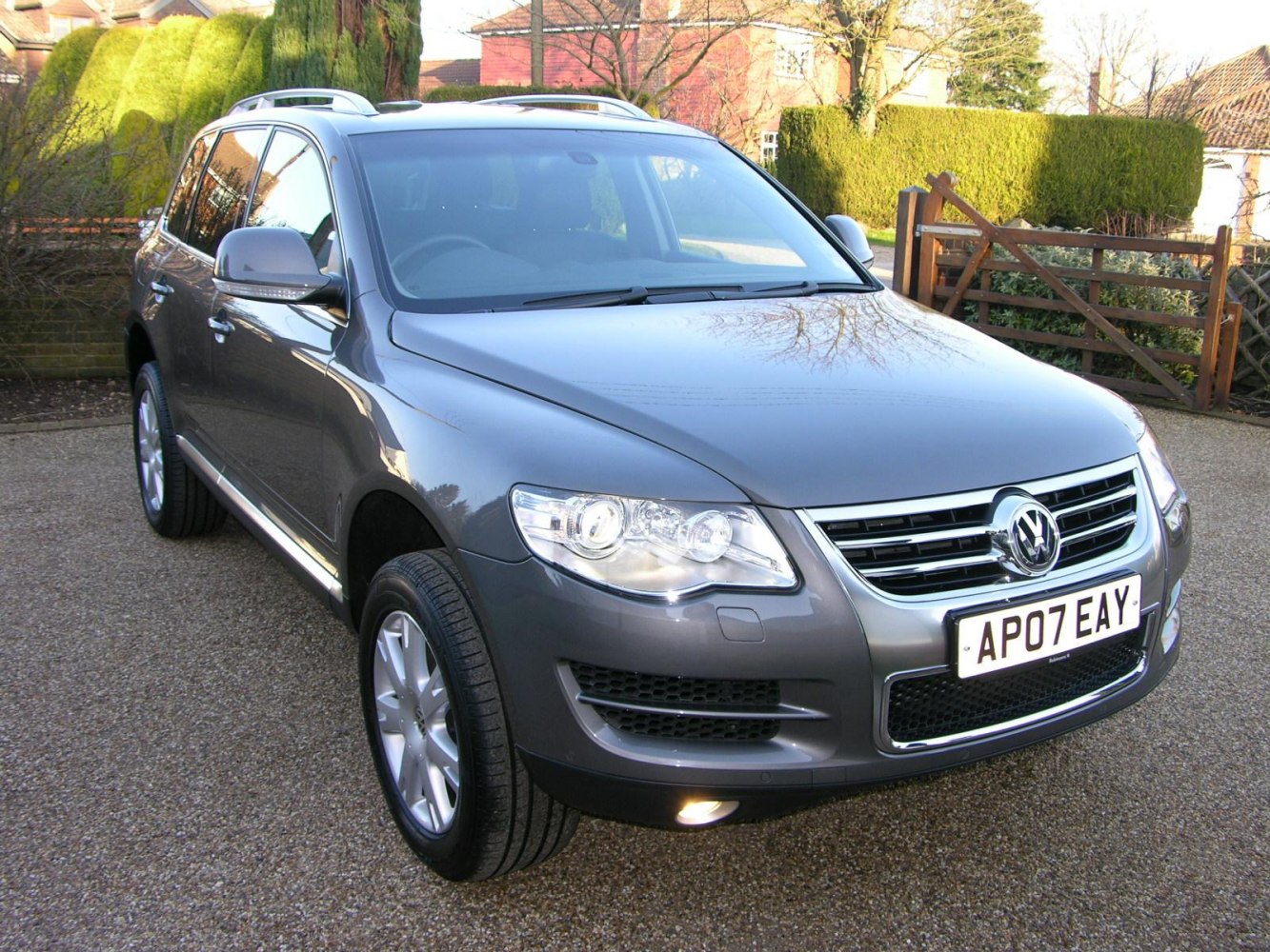 Front angled view of SUV with prominent headlights and grille