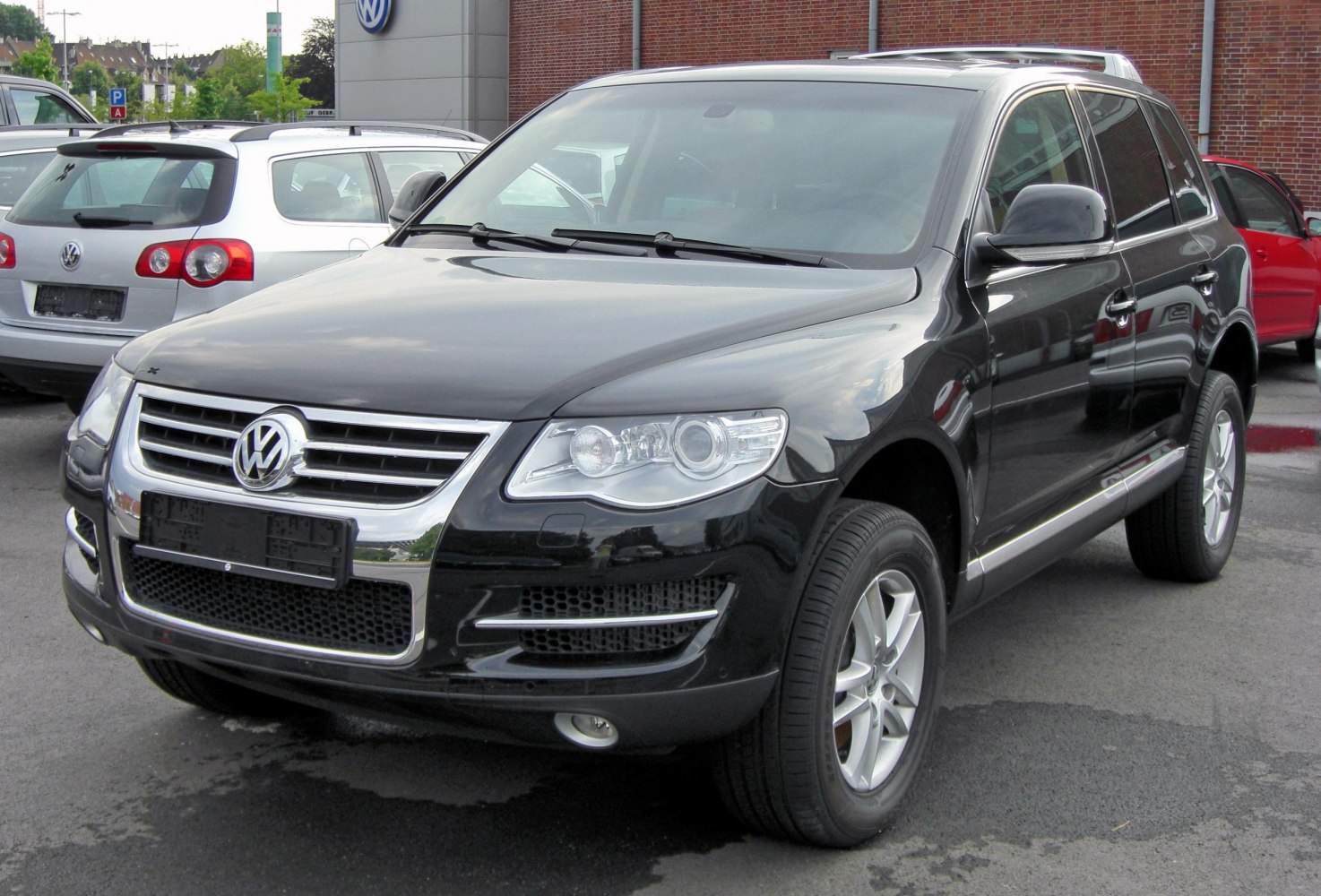 Front view of SUV with chrome grille and distinctive headlights