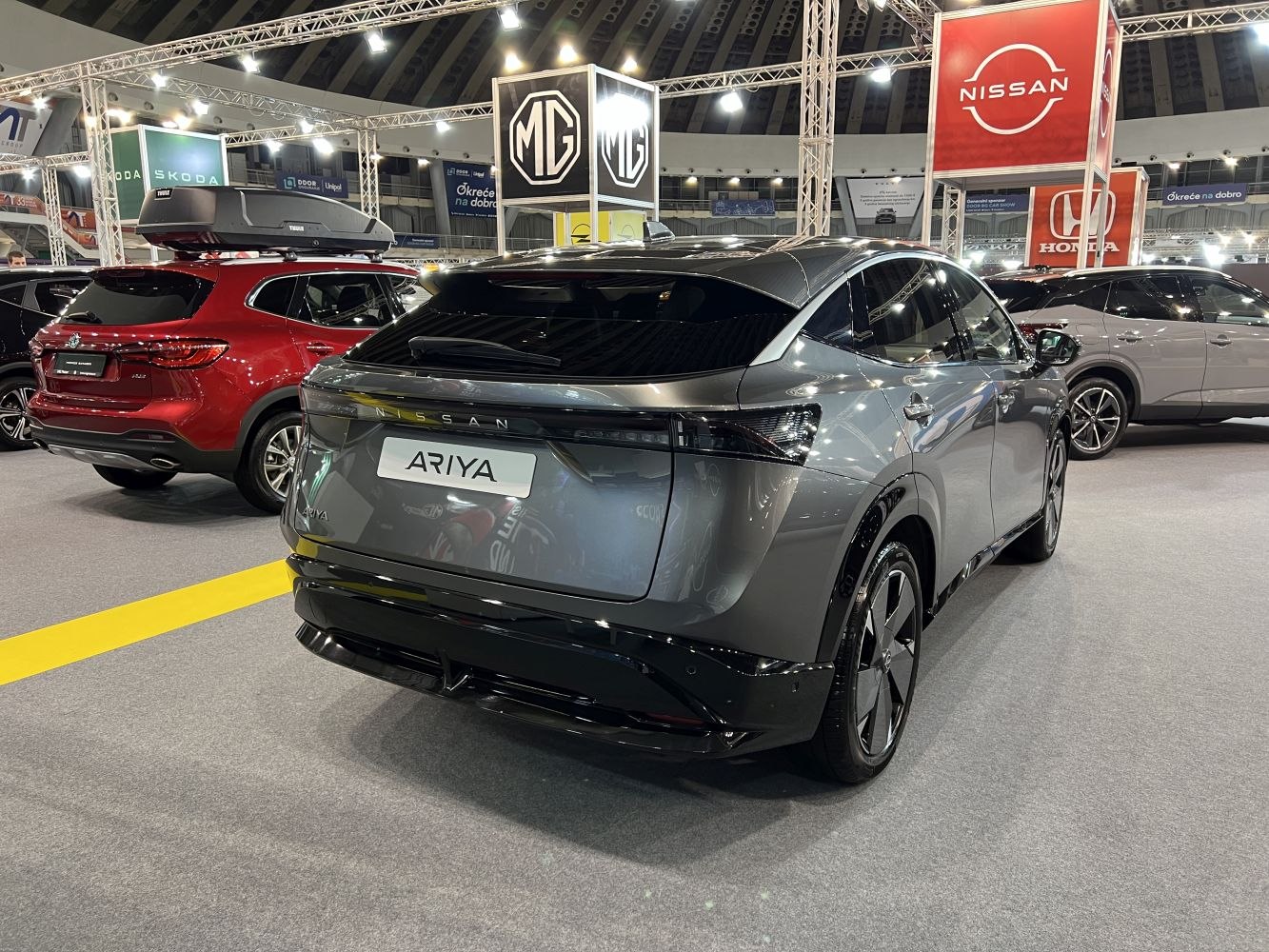 Sleek modern electric SUV rear with tinted windows and aerodynamic design