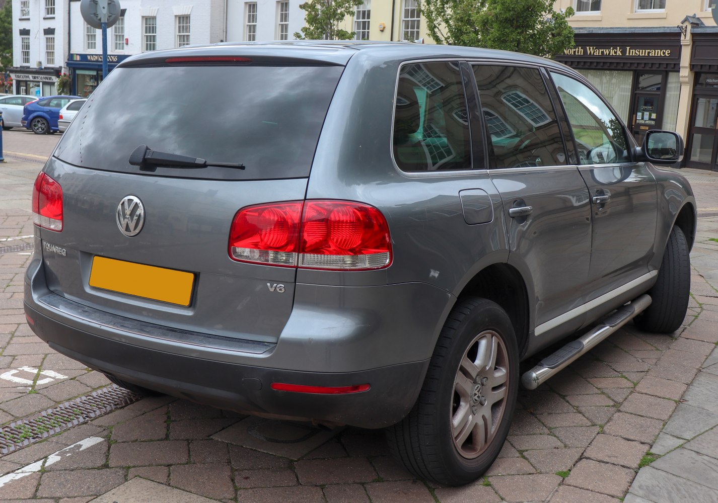Rear and side view of SUV with red taillights and alloy wheels