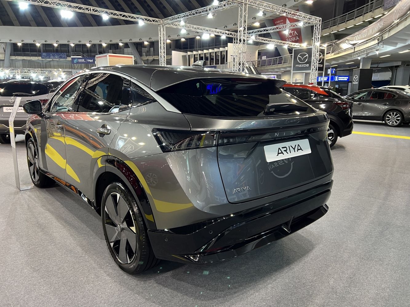 Rear and side view of sleek electric SUV with LED lighting and aerodynamic styling