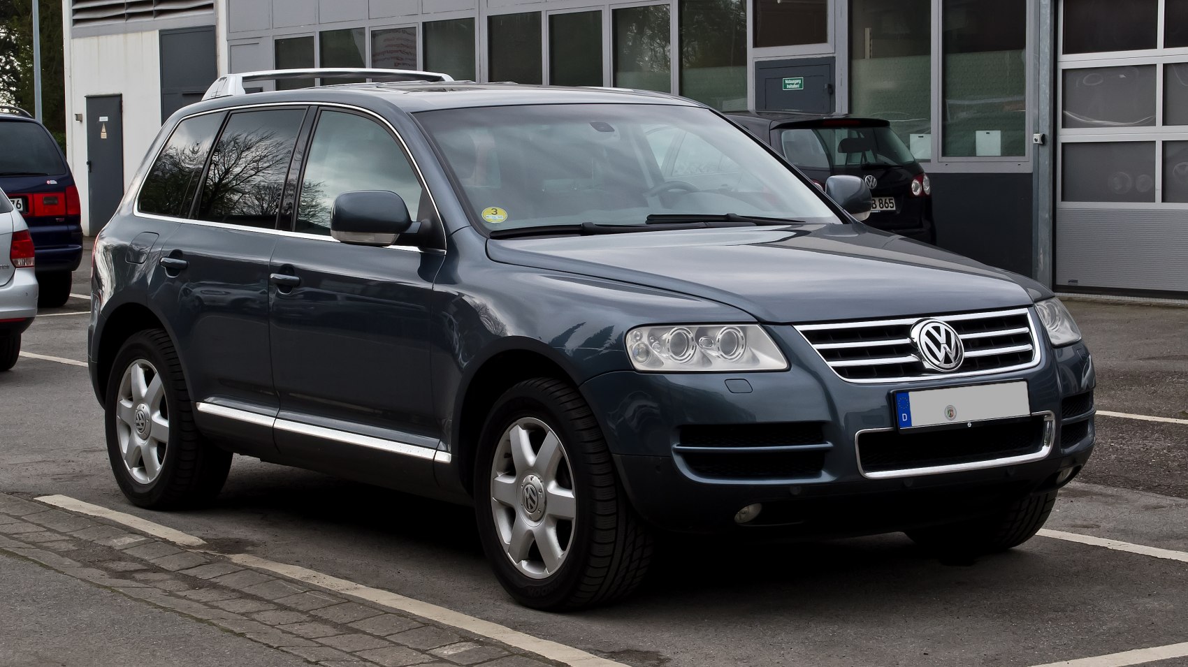 SUV with chrome-accented front grille and clear multi-lens headlights