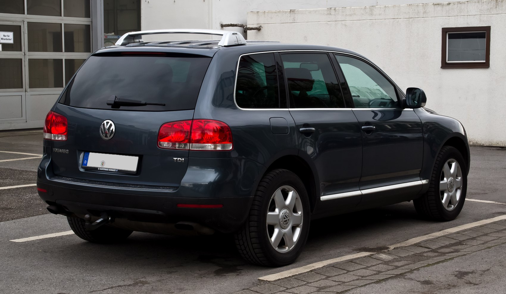 Rear view of SUV with roof rails, alloy wheels, and TDI badge