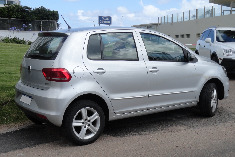 Silver 5-door hatchback rear side with alloy wheels and taillights